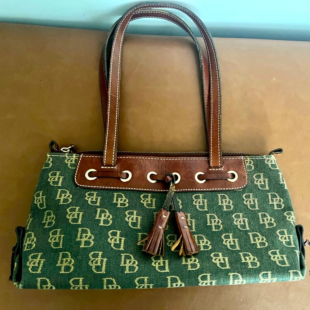 Dooney & Bourke Signature Logo tassel top zip satchel purse.
